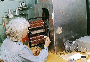 A technician weaving the core ropes at the Raytheon plant in suburban Boston.