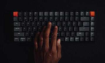black hand on keyboard